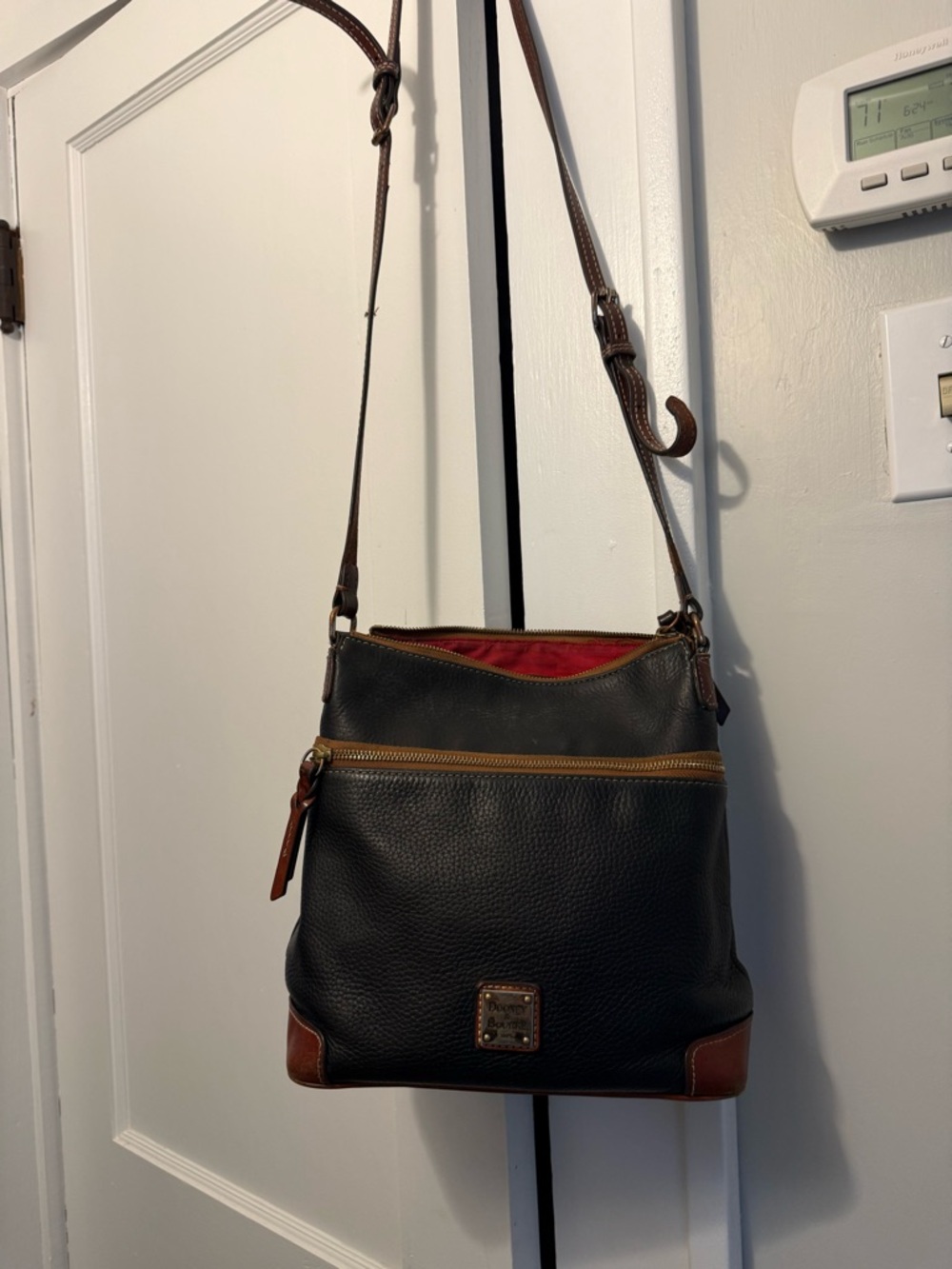 Dooney & Bourke Black Pebbled Leather Crossbody with Brown Trim and Red Lining